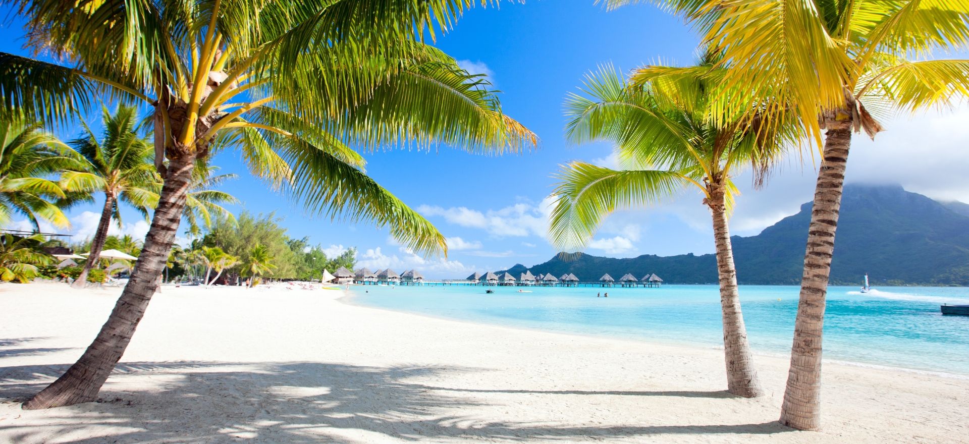 A stunning tropical scene of Bora Bora, French Polynesia, ideal for a luxury Christmas getaway by private jet charter.