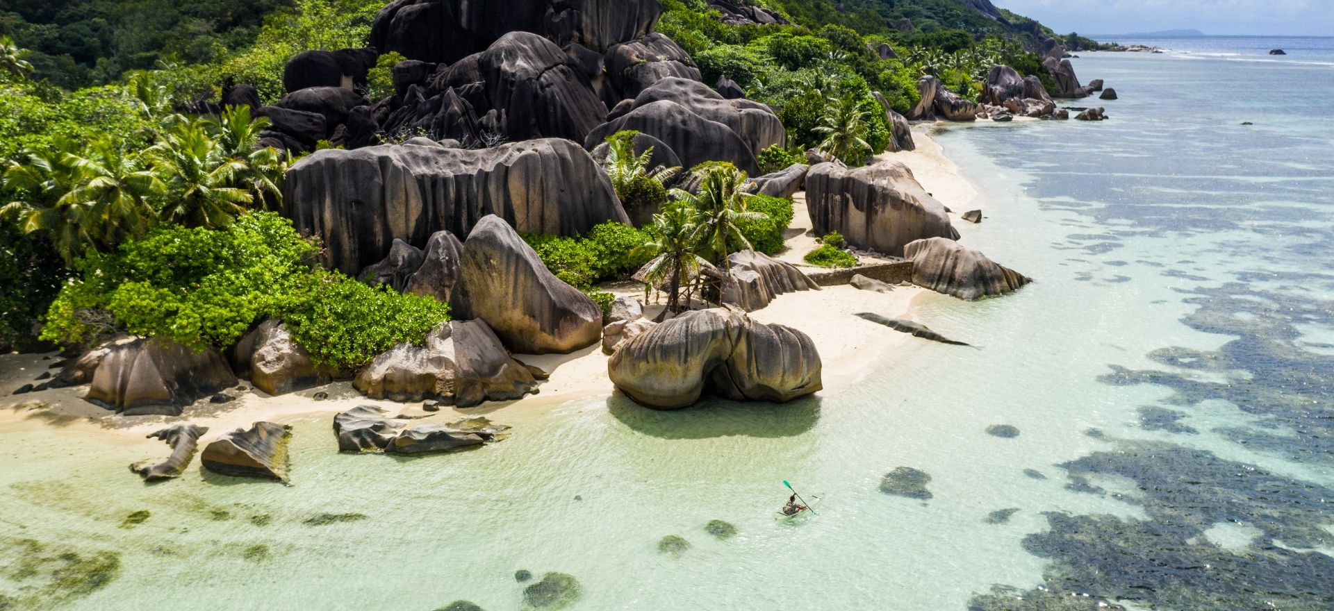 A stunning tropical paradise scene of Seychelles, ideal for a luxury Christmas getaway by private jet charter.